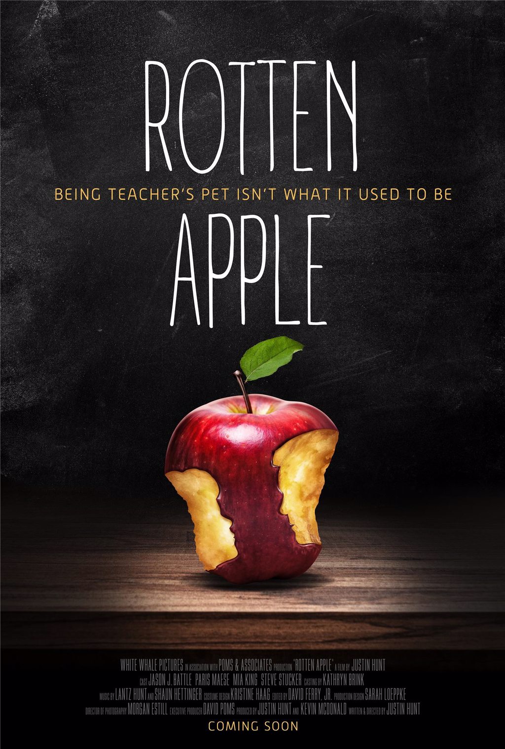POSTER FOR THE FILM ROTTEN APPLE BLACK CHALKBOARD BACKGROUND WITH THE FILMS TITLE AND THE TAGLINE BEING TEACHERS PET ISNT WHAT IT USED TO BE WITH A ROTTING APPLE WITH TWO BITES OUT OF IT AT THE BOTTOM